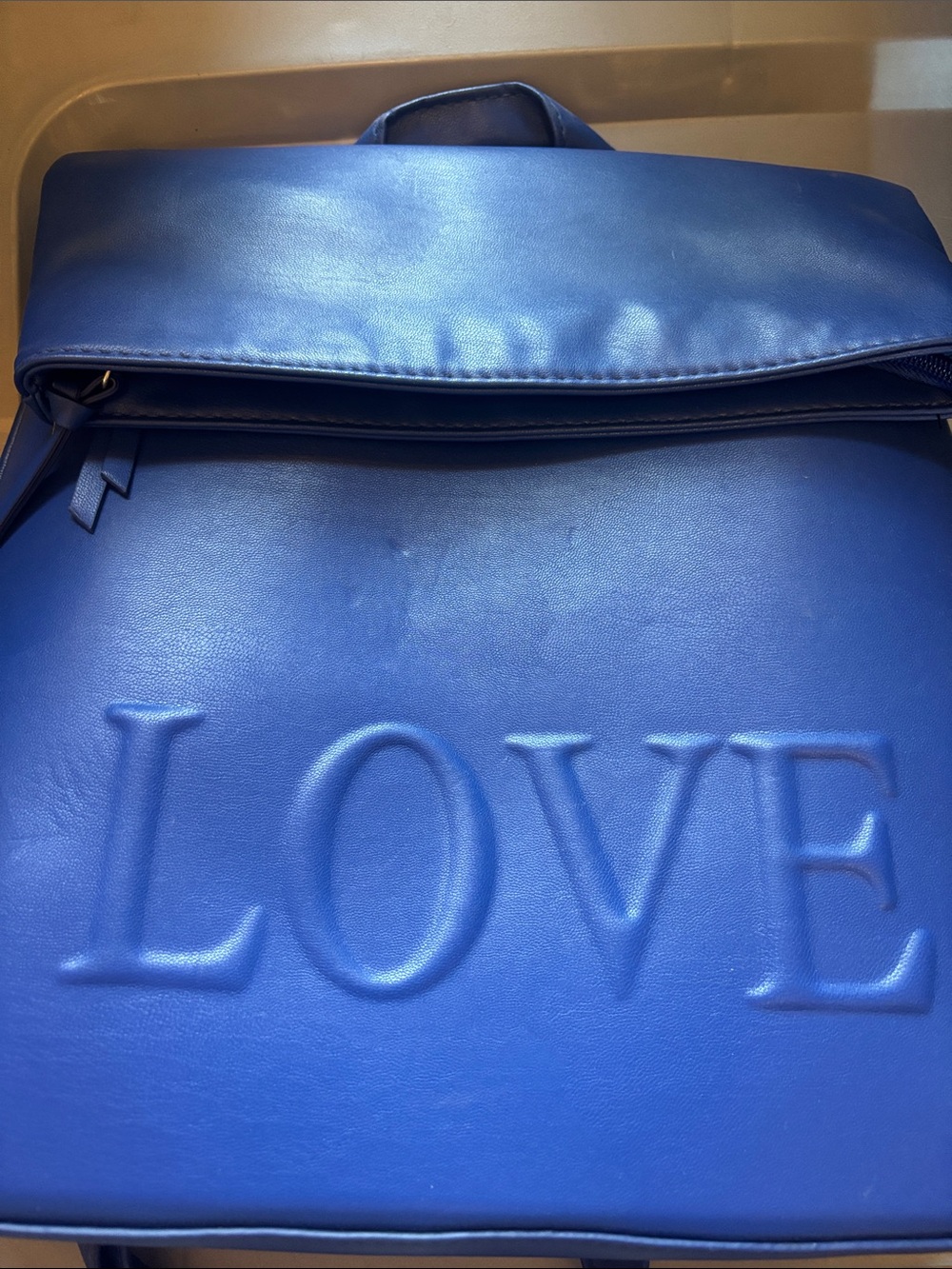 LOVE Embossed Blue Women's Backpack a Brash Royal Blue "LOVE" Embossed Backpack.
